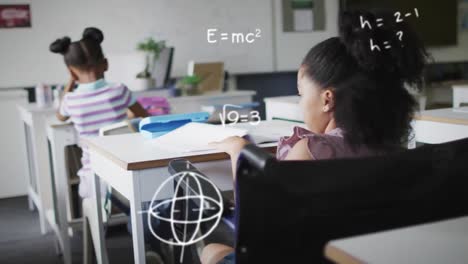 animation of maths calculations over happy biracial schoolgirl in wheelchair at desk in class