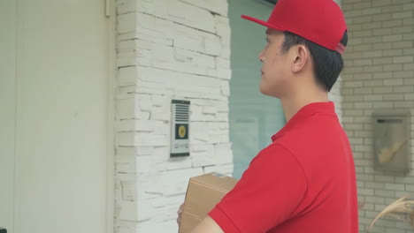 delivery man uniform smiles during express rings doorbell, courier holding a small package parcel delivering goods to customer's home with van truck, door-to-door services