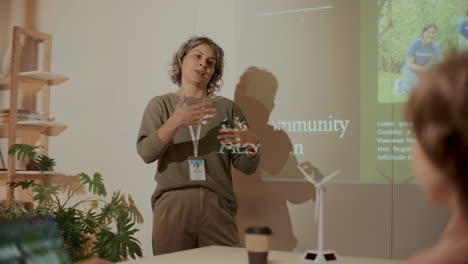 female engineer explaining renewable energy concepts in business presentation