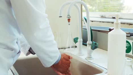 Scientist-washing-his-hands-in-sink