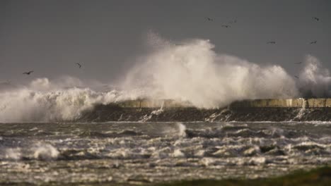 powerful storm waves crashing against lighthouse