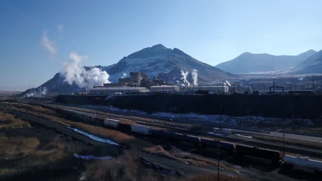 aerial morning fly over the kenicott cooper mine factory in magna, ut