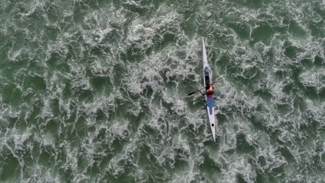 birds eye view of a person kayaking at lagoon beach in cape town south africa