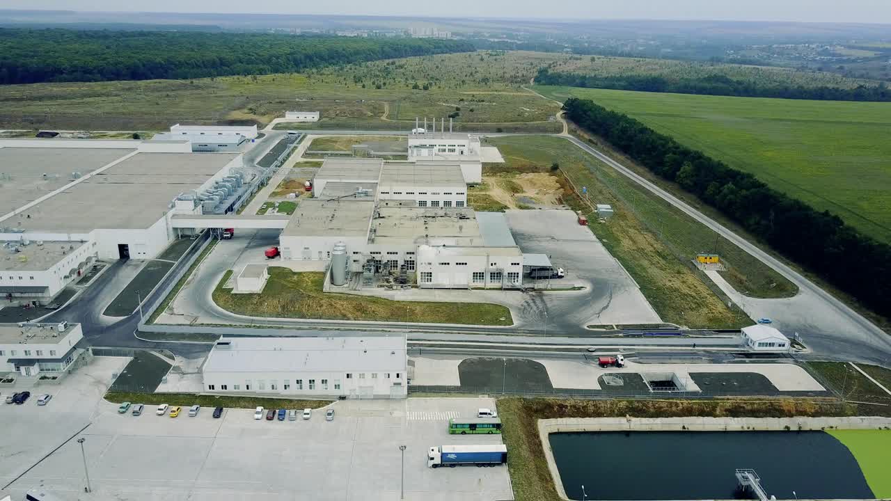 Gray facade made of aluminum panels with doors and windows on industrial building