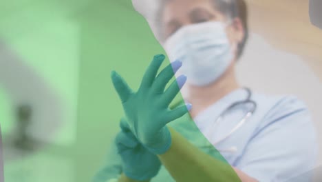 Animation-of-flag-of-ireland-with-female-doctor-in-face-mask-putting-on-surgical-gloves