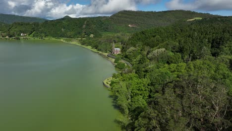 Chapel-Of-Nossa-Senhora-das-Vitorias-Surrounded-By-Furnas-Lake-And-Lush-Forest-In-Sao-Miguel-Island,-Portugal