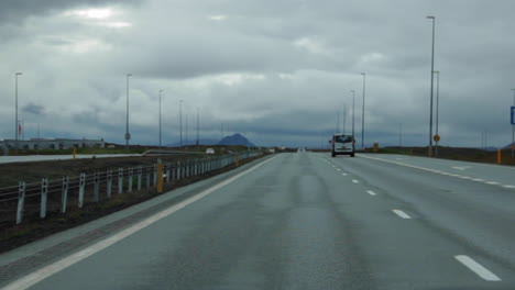 car driving down road in iceland