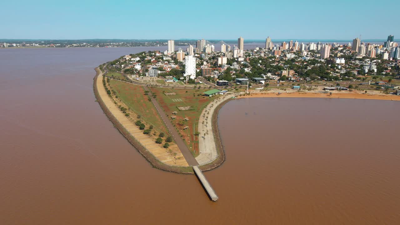 Scenic aerial view of Bahia do Brete in Posadas, Argentina, framed by the majestic waters of the Paran&aacute; River