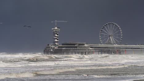 stormy weather at the pier with ferris wheel