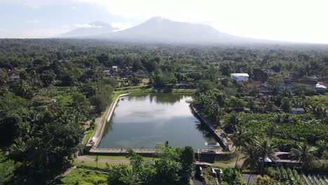 beautiful aerial view of kaliaji reservoir, a reservoir located in turi, sleman regency, yogyakarta. an attractive reservoir with a view of mount merapi in the background.
