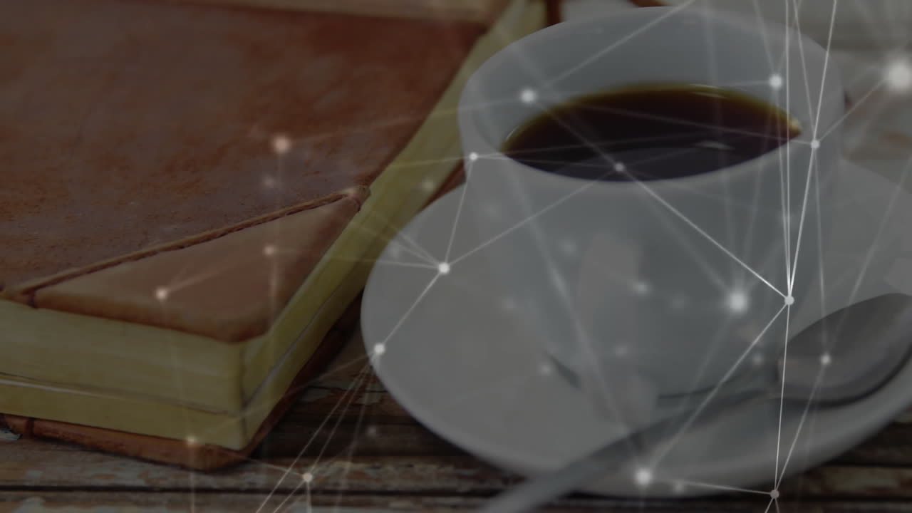 White ceramic coffee cup showing on wood table, featuring journal, teaspoon, network overlay glitch