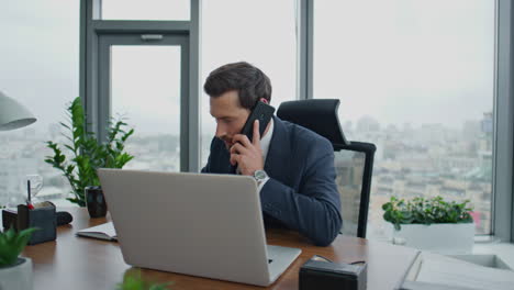 entrepreneur have phone negotiation sitting at office desk close up. man talking