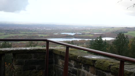 Scenic-Autumn-woodland-countryside-Lancashire-stone-terraced-observation-landmark-dolly-right