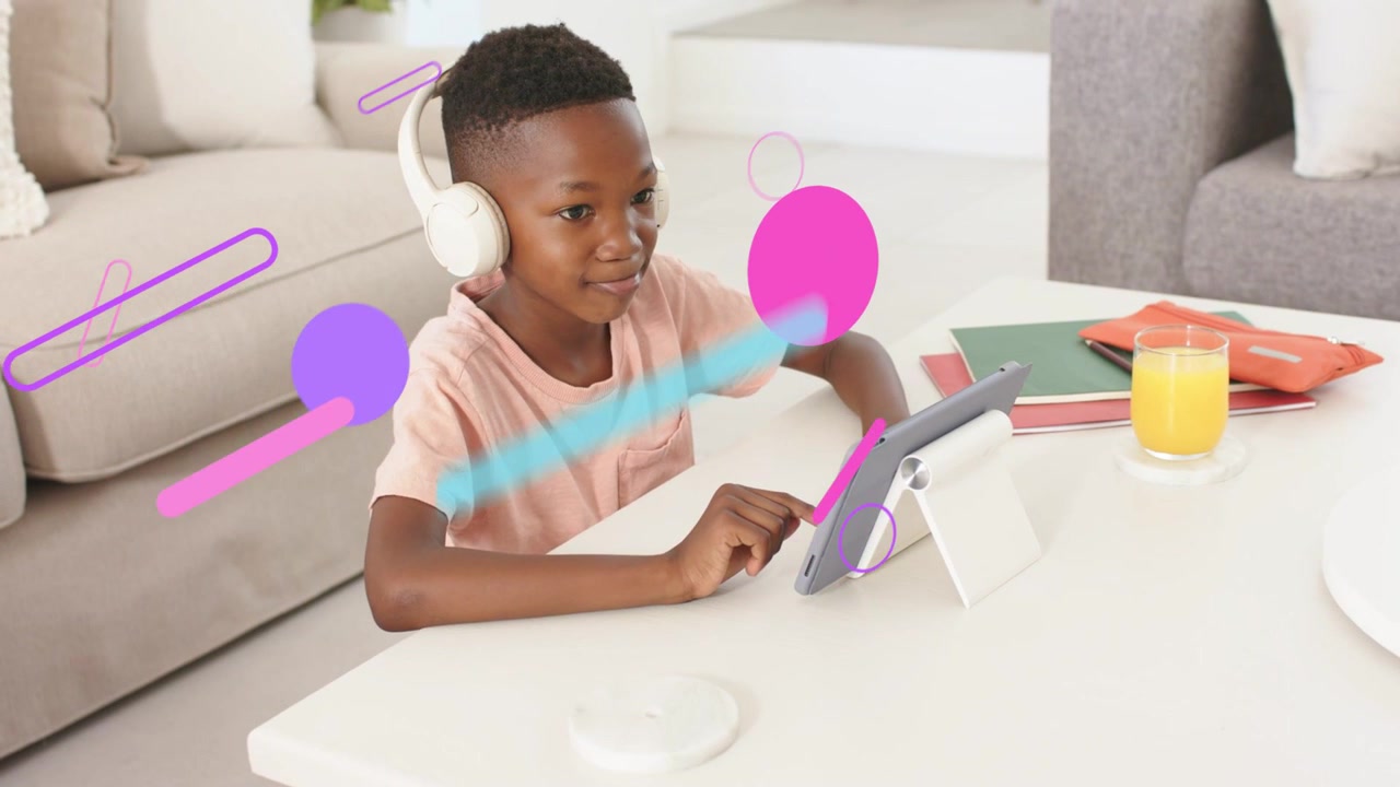 Male student tapping tablet and starting colorful shapes growing across frame, supporting education