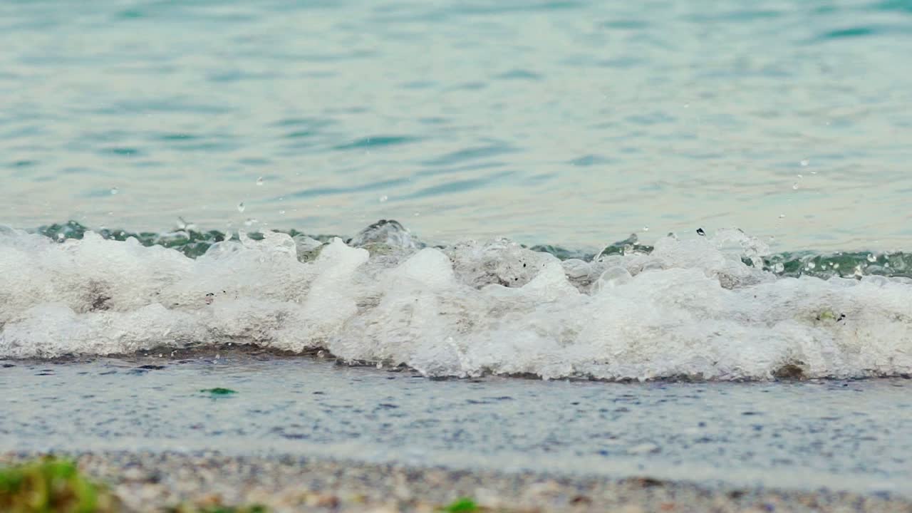 Wave of the sea on the sand beach. Big sea wave. Slow motion