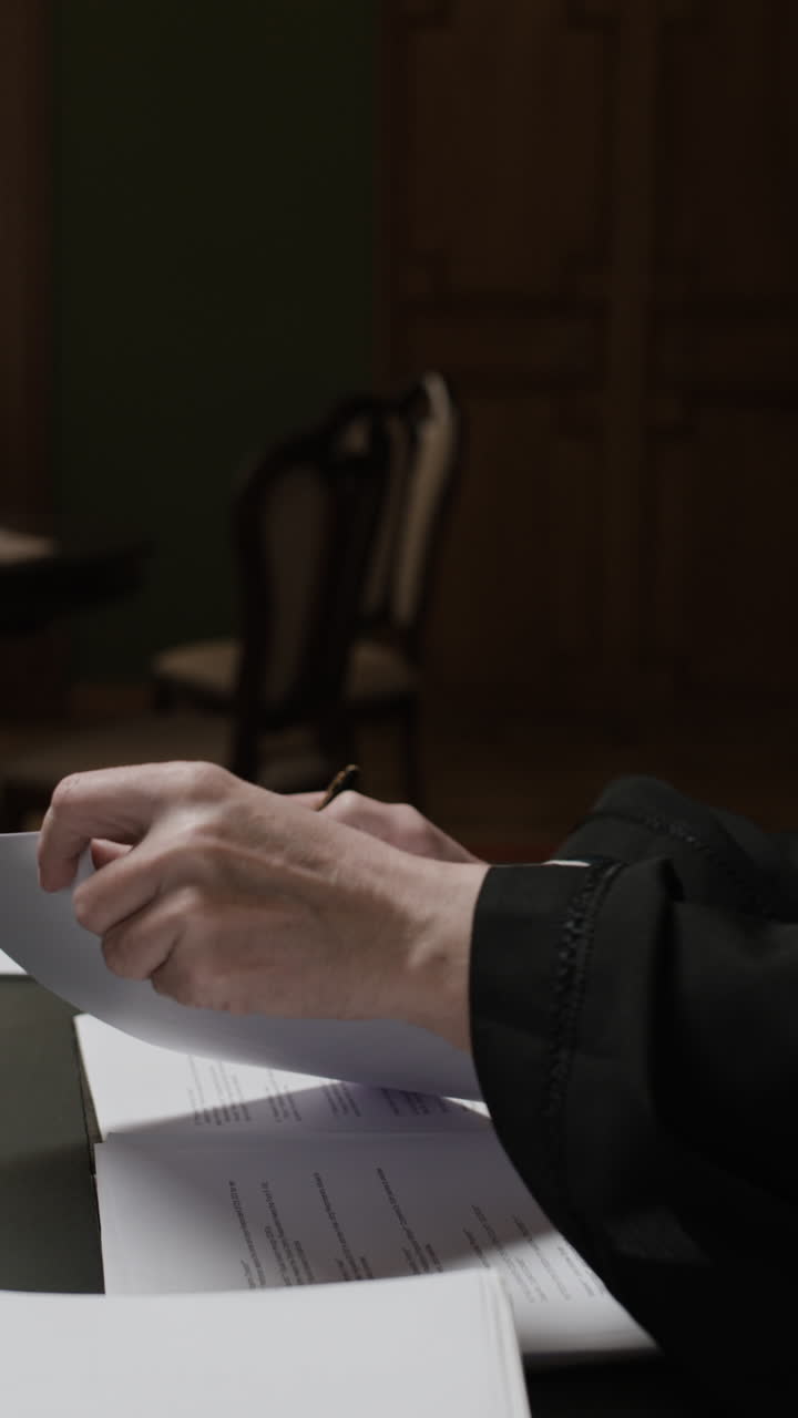 Judge Reviewing Documents in Courtroom