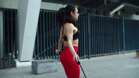 close up sport woman jumping with skipping rope. female athlete making mistake