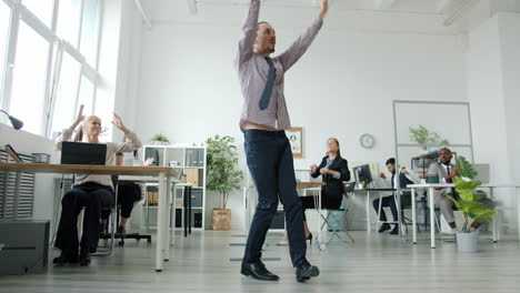 happy office workers celebrating