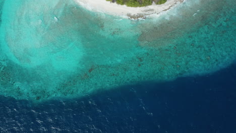 Aerial-top-down-view-of-Island-Horubadhoo-with-crystal-clear-water-and-white-beaches-in-Maldives