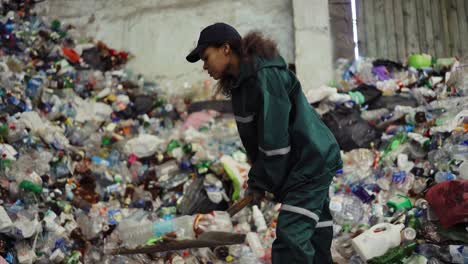 Aerial-view.-A-dump-truck-unloads-a-pile-of-garbage-at-a-landfill.-Dump-of-unsorted-waste.-Drone-shot-of-working-trash