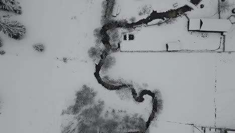 bird eye following the river during the winter 4k