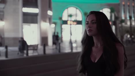 beautiful girl in the background of a night city