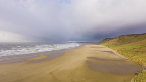 dramatic coastal scenery with beach and waves