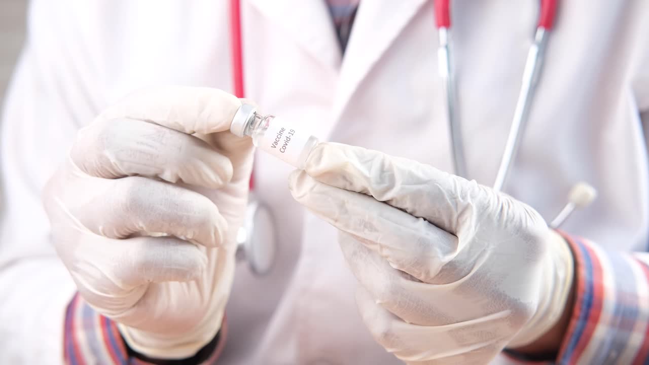 Doctor Holding Covid-19 Vaccine