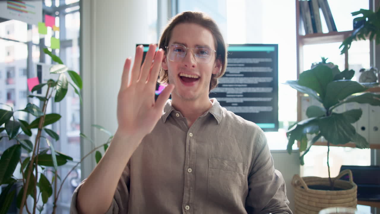 A man holding a phone indoors