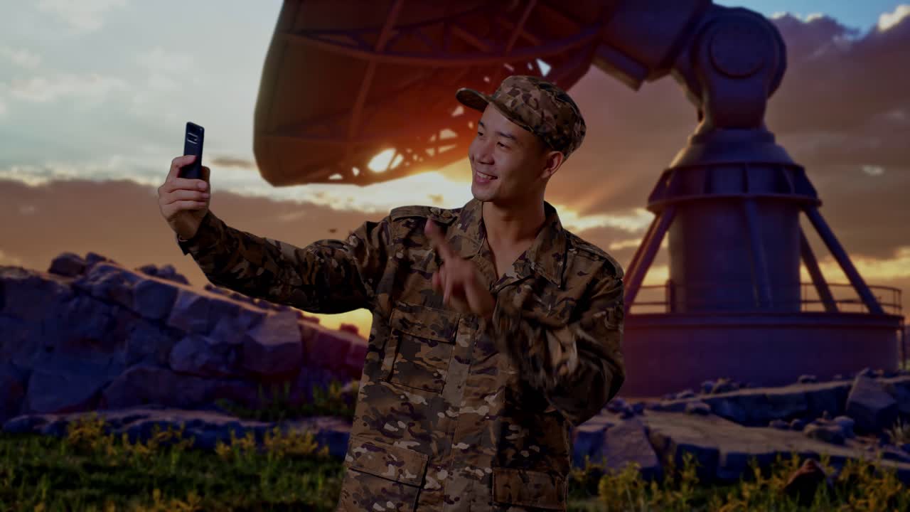 Asian Man Soldier Using Smartphone Taking Picture While Standing With Satellite Dish