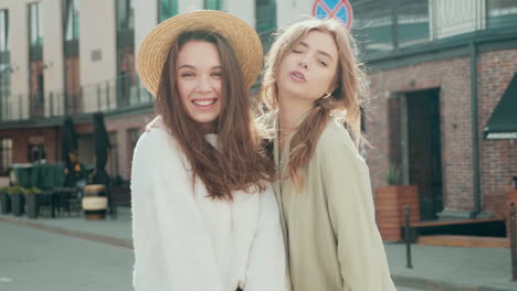 two young women posing outdoors