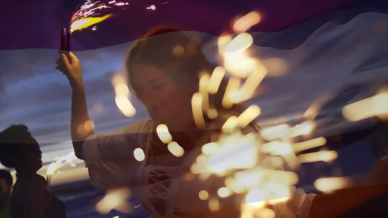 해변에서 즐겁게 지내는 친구 그룹 위에 네덜란드의  ⁇ 발을 흔드는 애니메이션