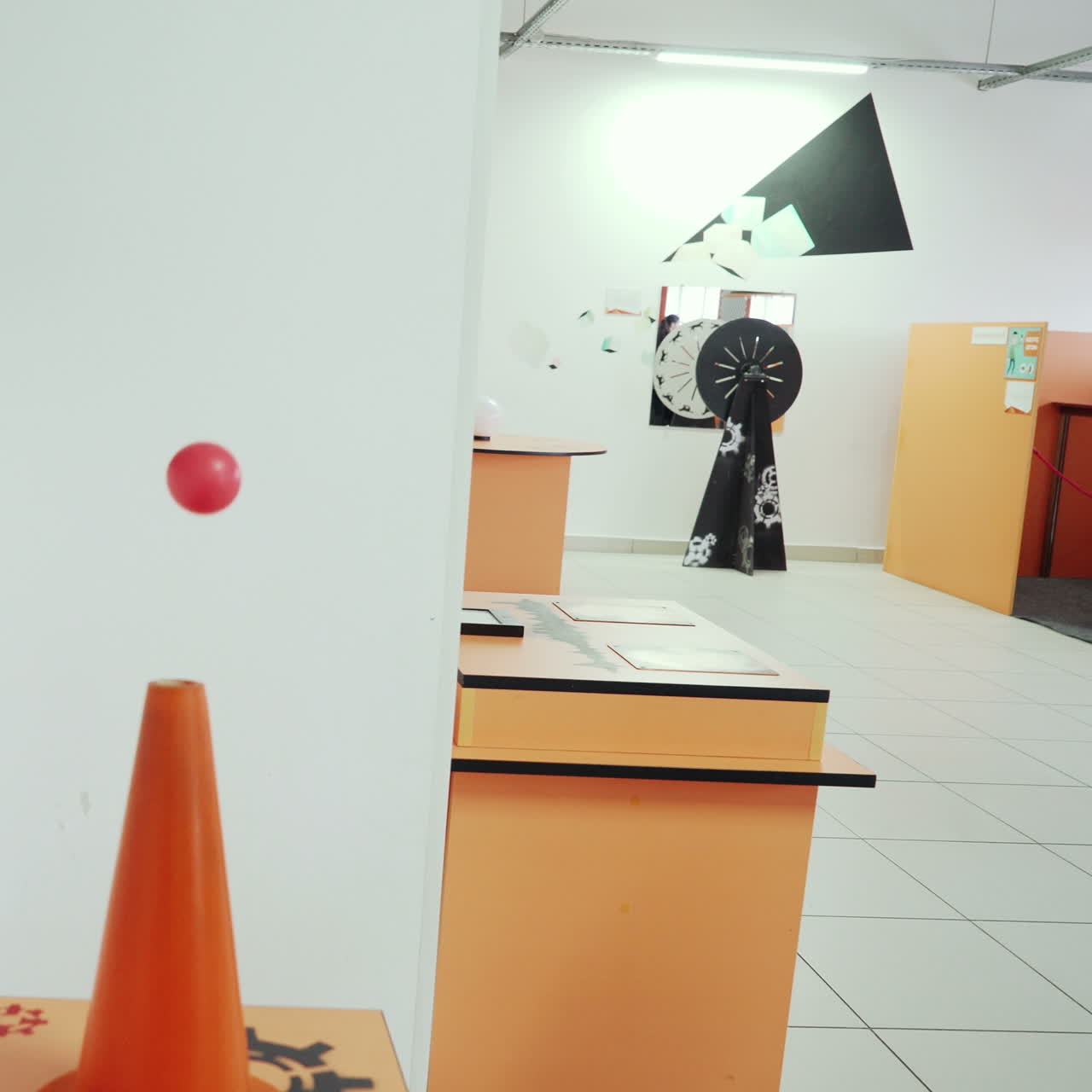 Ball flying over the air flow. Child in the Research Center. Square video
