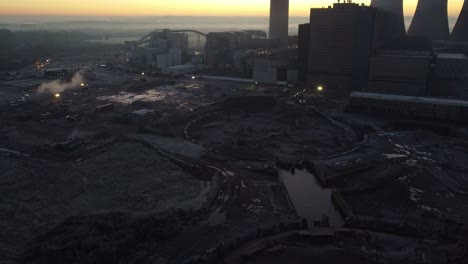 Fiddlers-Ferry-power-station-aerial-view-across-partial-demolished-cooling-towers-wreckage-in-early-morning-sunrise