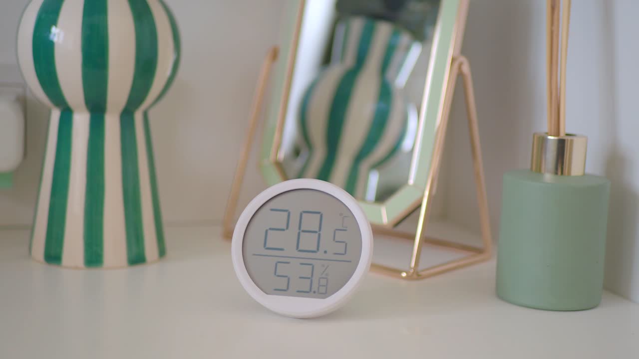 Close-up of a Digital Thermometer and Home Decor