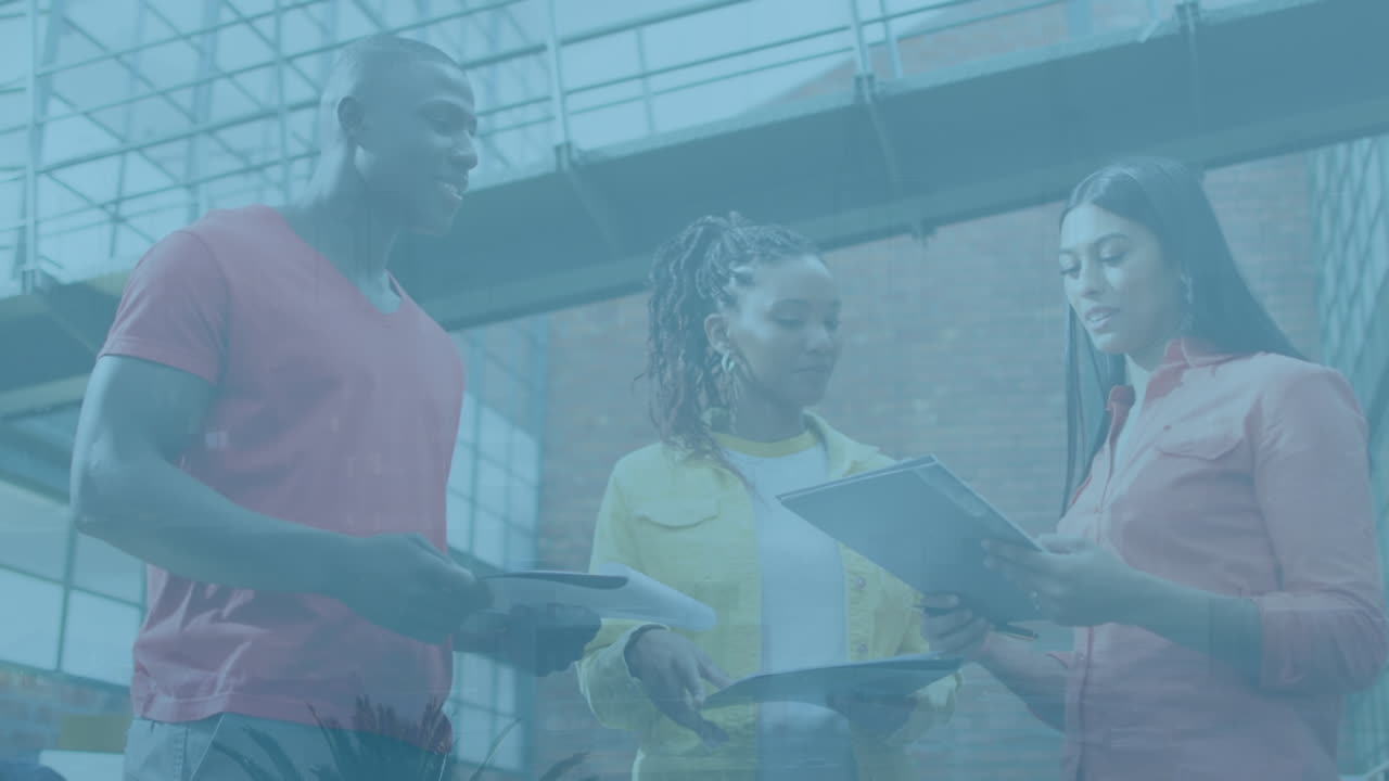 Animation of cityscape over diverse business people in office