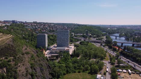 aerial drone view of faculty of humanities charles university in prague, czech republic, traffic in background-1