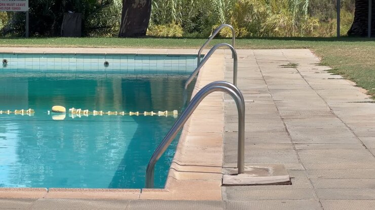 Ladders leading into a pool at a resort in Cape Town