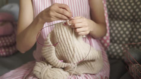 woman knitting wool clothes from woolen yarn. woman leisure knitting wool yarn