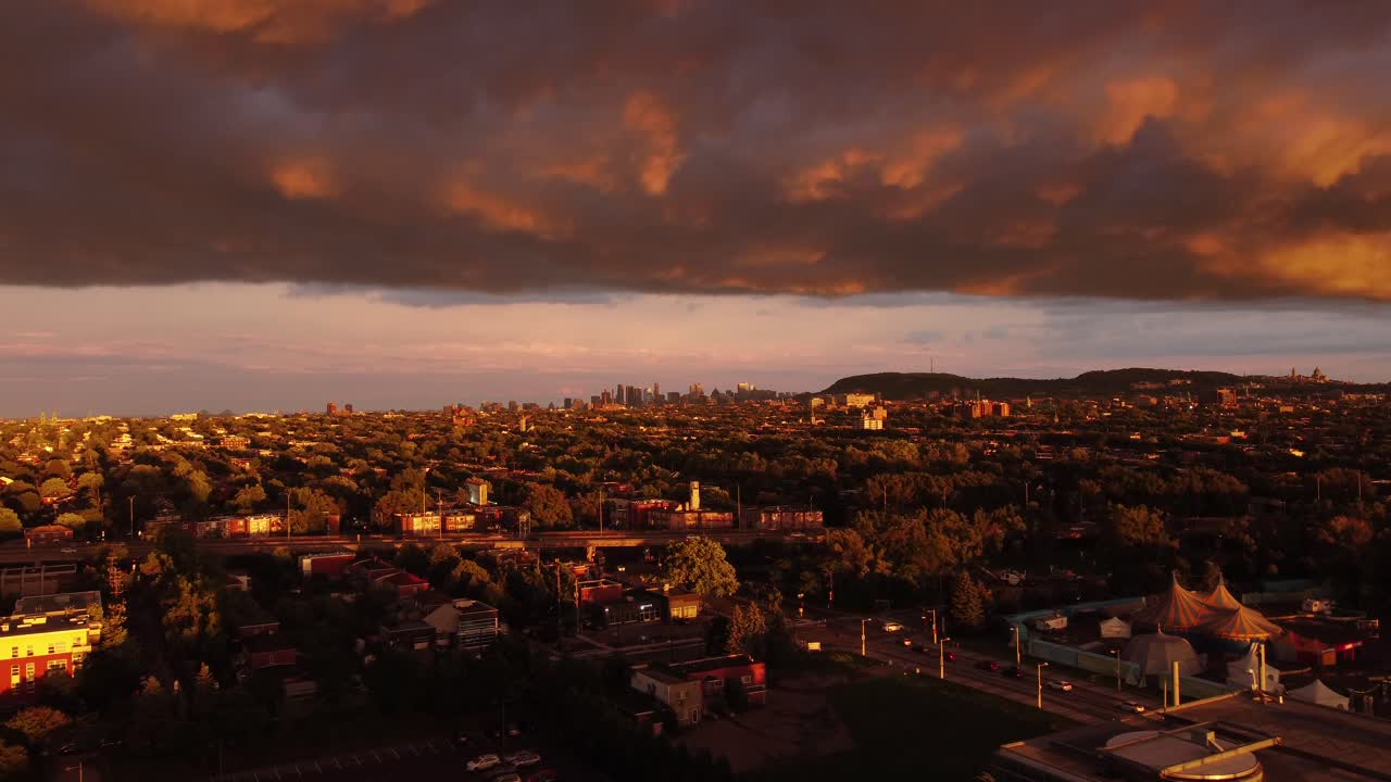 Golden hour sunset Montreal city view with Mont Royal under heavy cloud