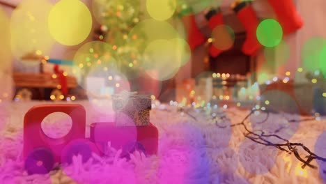 animation of glowing spot lights over christmas decorated room