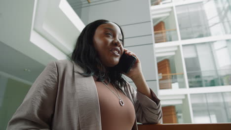 African-American-Business-Lady-Speaking-on-Phone-in-Office-Center