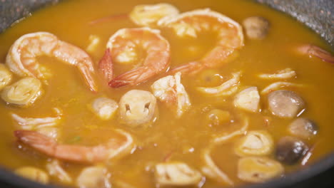 boiling cooking spicy sour tom yum kung shrimp and mushroom soup, thai food tom yum soup