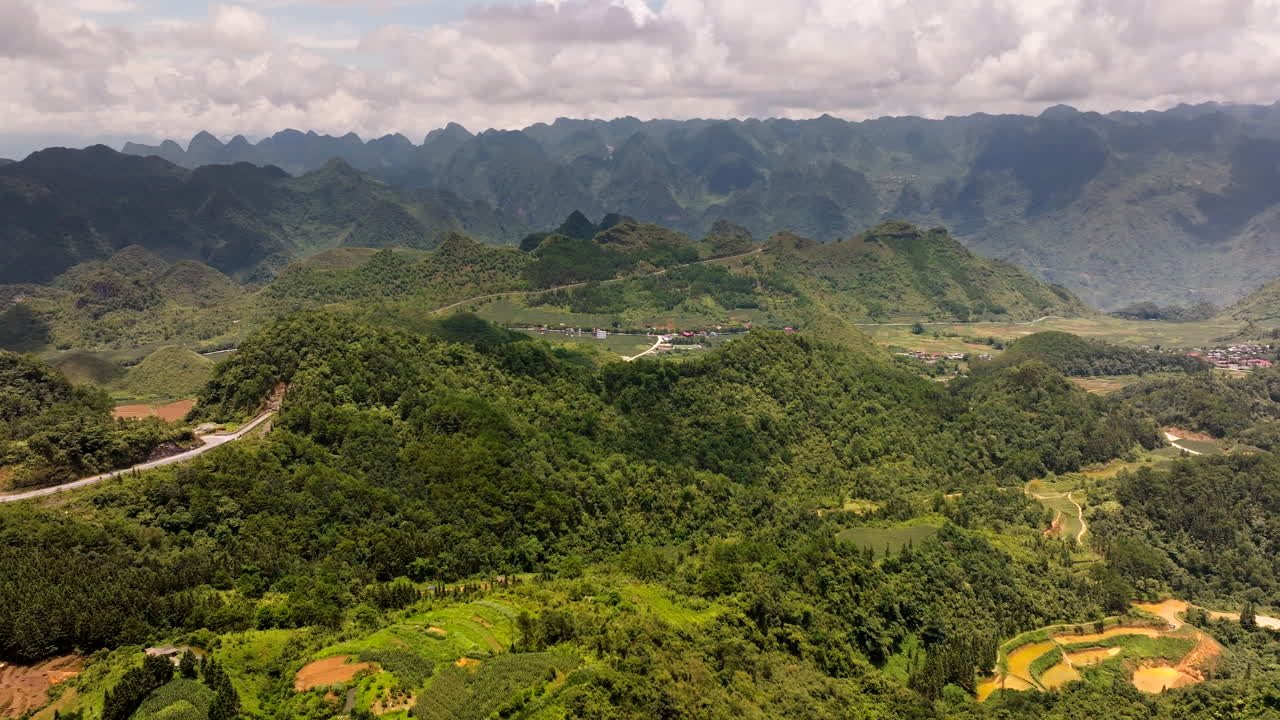 Ha Giang Loop, Vietnam, Asia - A Picturesque Motorbike Route Nestled Among Mountains and Surrounded by Lush Vegetation - Aerial Drone Shot
