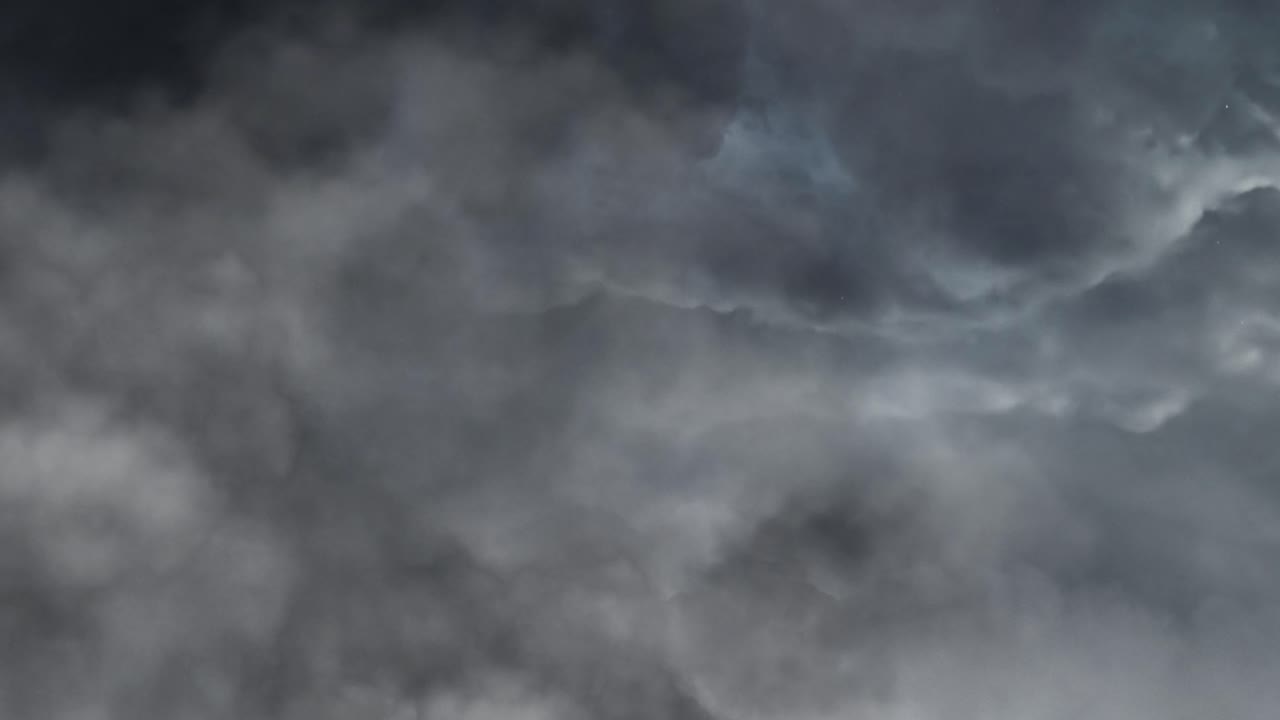 lightning strikes during a storm in dark cumulonimbus clouds