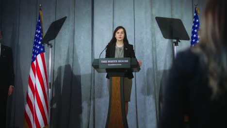 US-presidential-candidate-comes-to-tribune,-starts-performance,-answers-journalists-questions-and-gives-interview.-Female-American-republican-politician-at-press-conference.-Elections-day.-Dolly-shot.