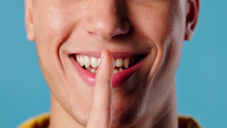 man gesturing for silence