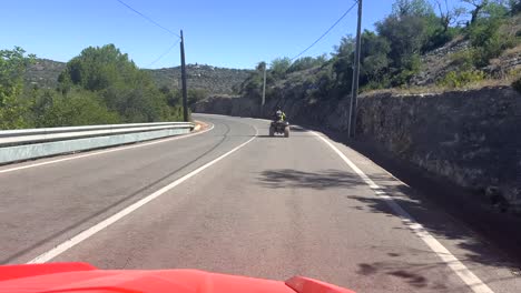 Point-of-View-Of-Driver-Driving-Down-Mountain-Road-In-Alberfeira-Portugal