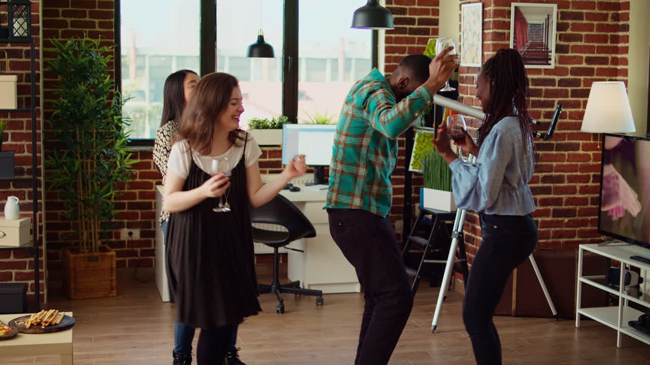 Smiling friends enjoying time spent together, busting into dynamic dance moves