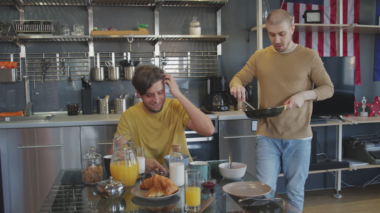 Happy Man Surprising Male Partner with Breakfast